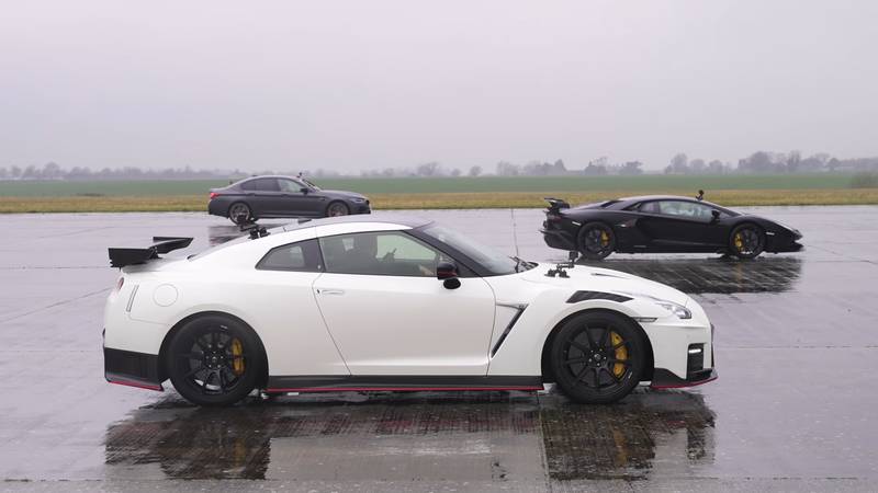 Watch A German Family Performance Sedan Take On A Revered Japanese Sports Car And A V-12 Italian Supercar!
- image 1064960